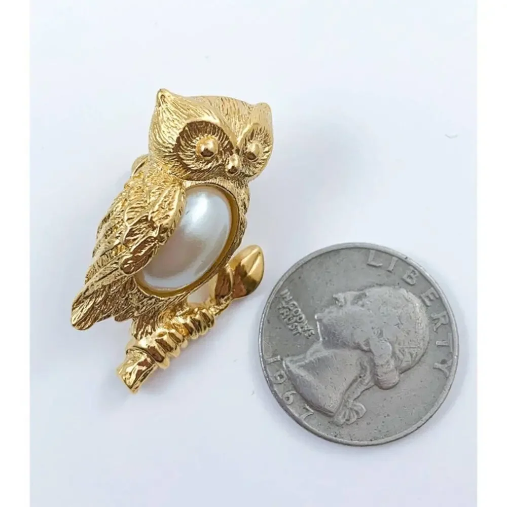 Avon gold tone owl pin back, with a large faux pearl body 1995